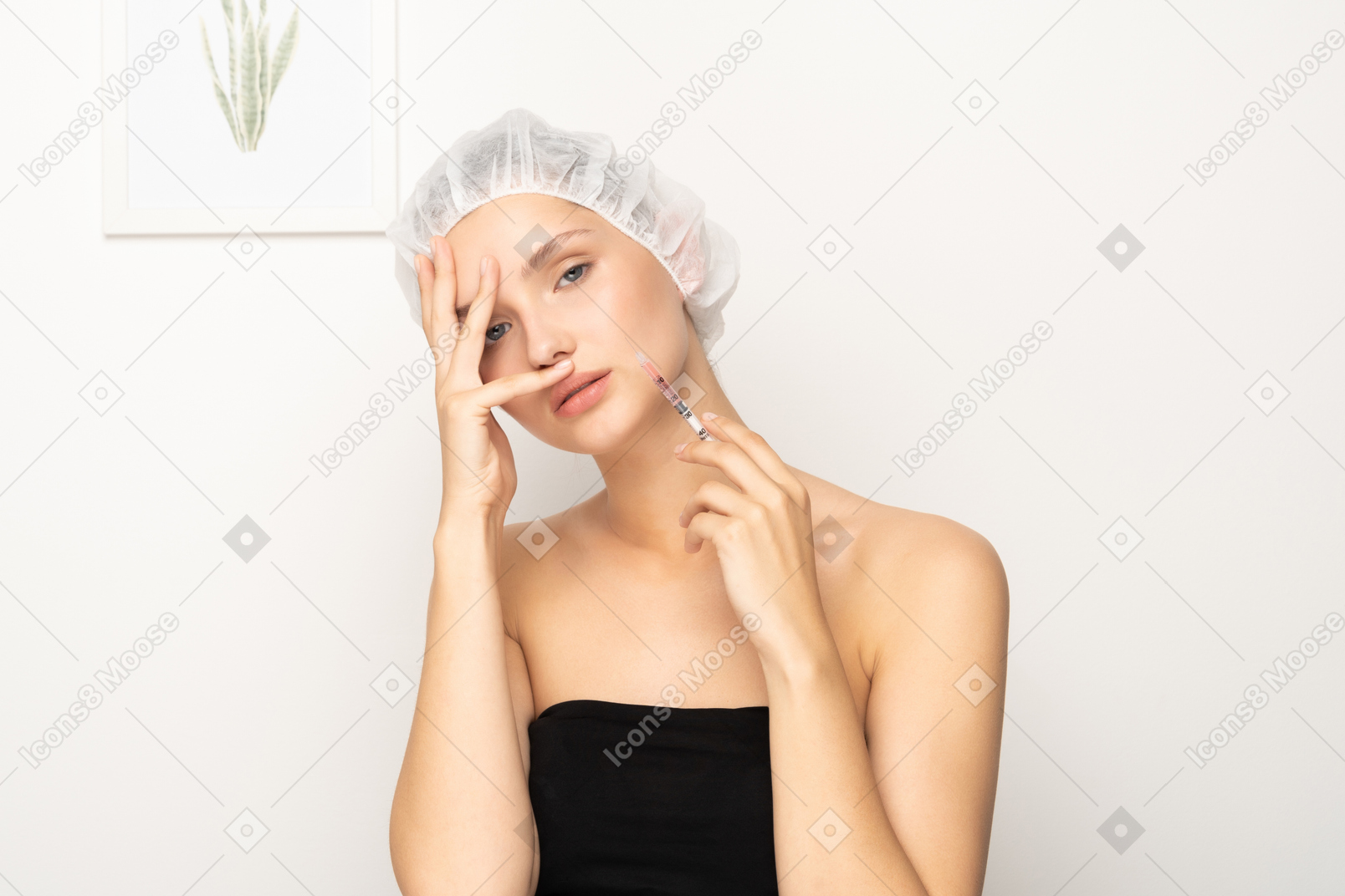 Woman with syringe looking at camera