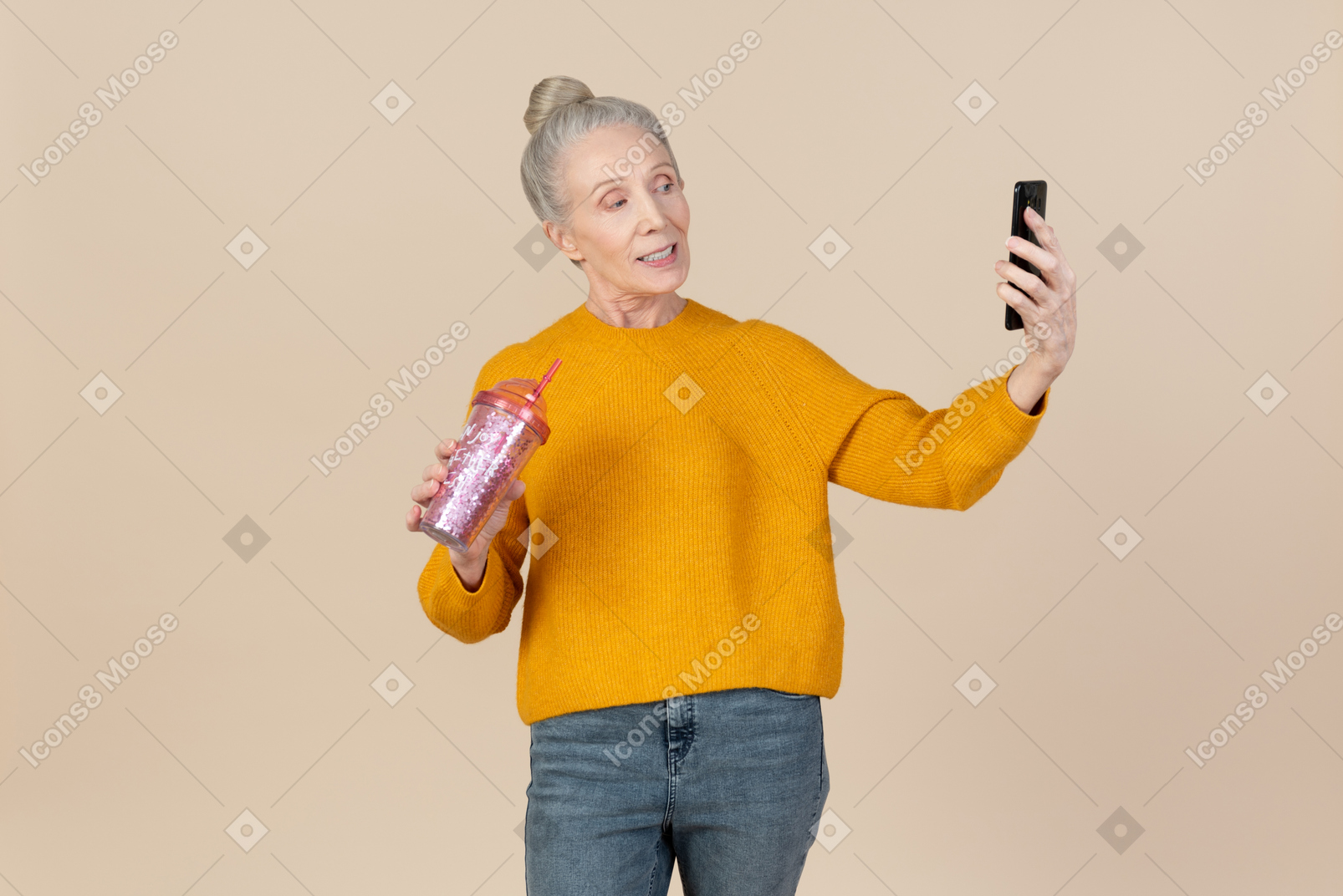 Old woman holding plastic cup to go and making selfie