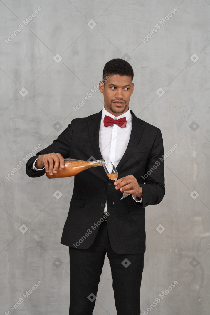 Man pouring champagne into a flute glass