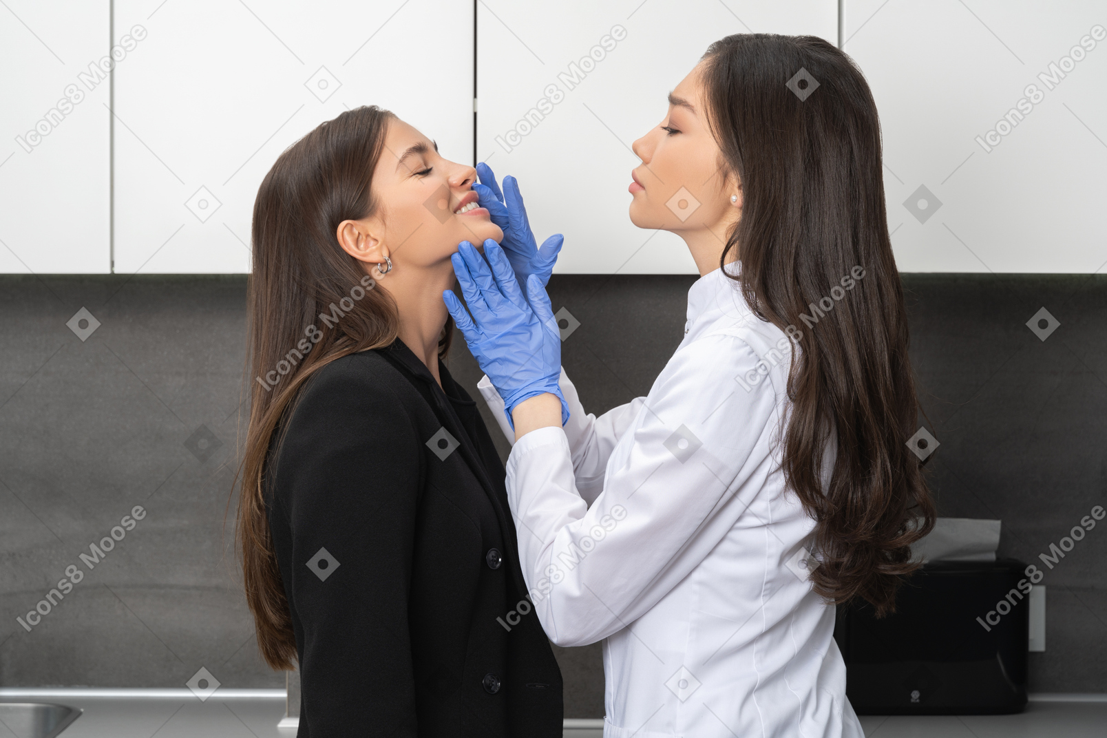 Female doctor examining patient's mouth