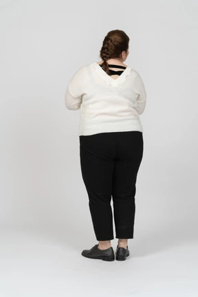 Rear view of a plump woman in casual clothes