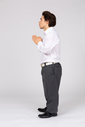 Male office worker with folded hands