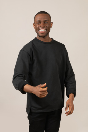 Young man standing and smiling