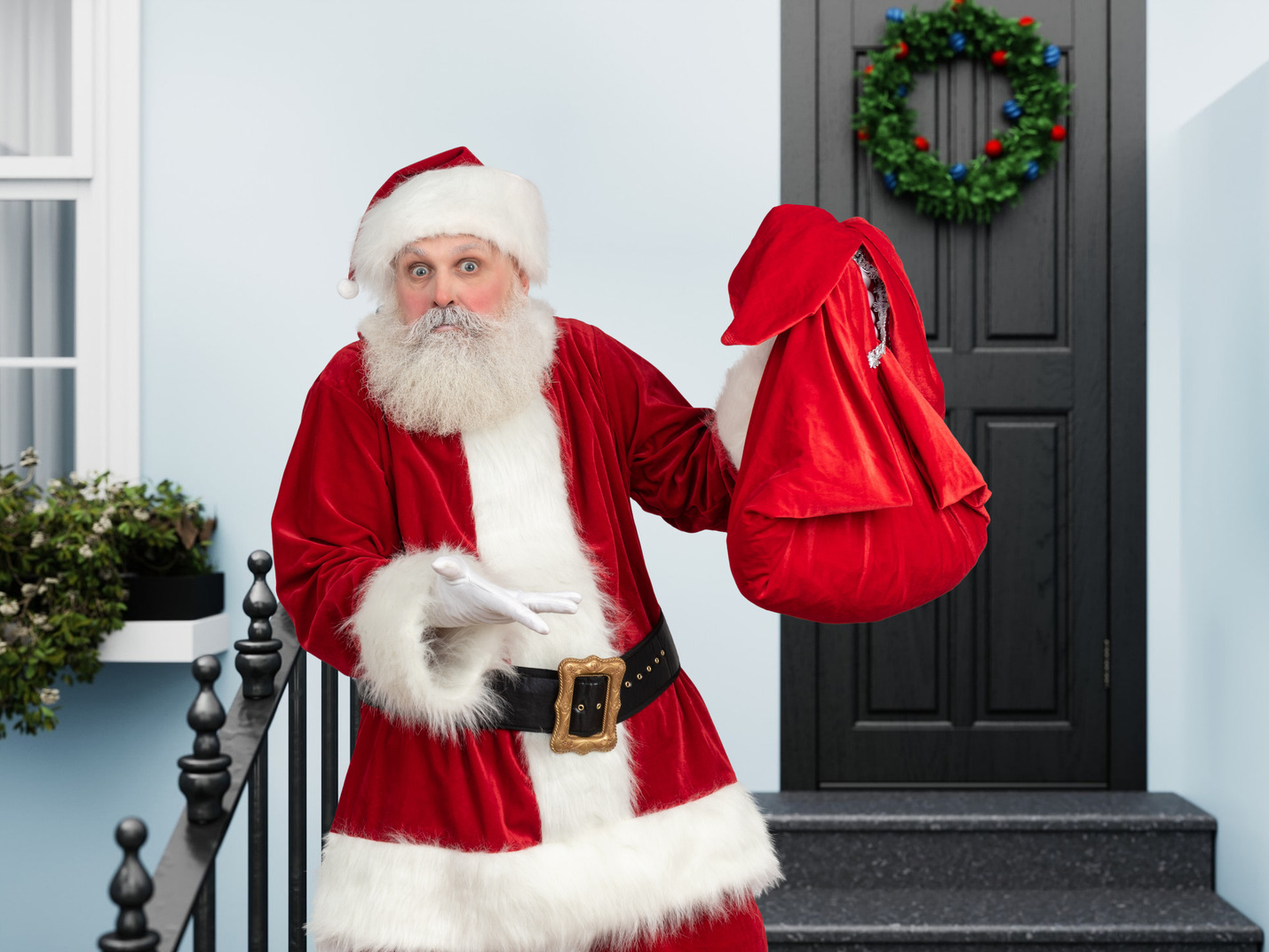 Santa claus is embarassed with how many gifts this house has ordered