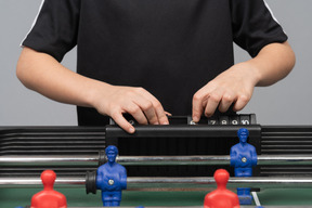 Man changing score in the game of table football