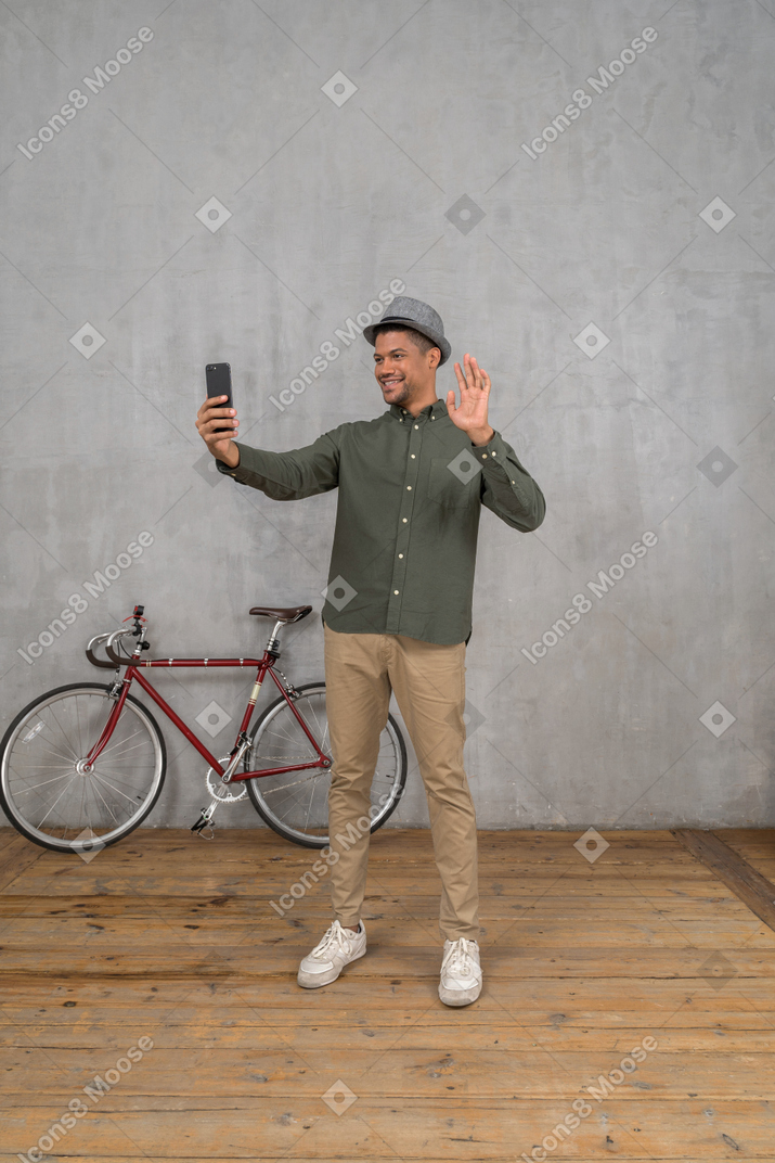 Man with smart phone video chatting