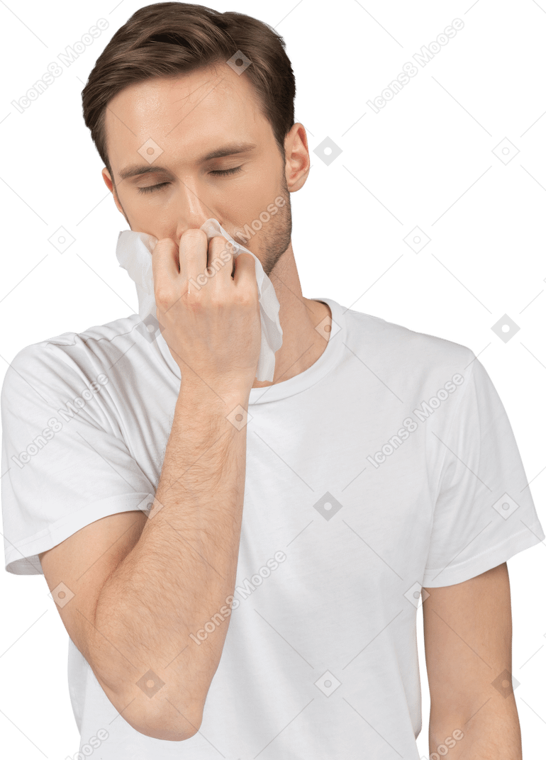 Front view of a young man smelling facial mask