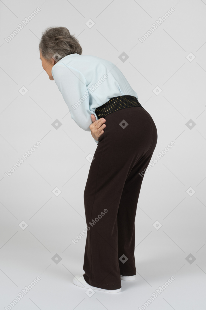 Old woman having stomach ache