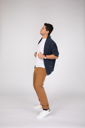A man in a white shirt and brown pants