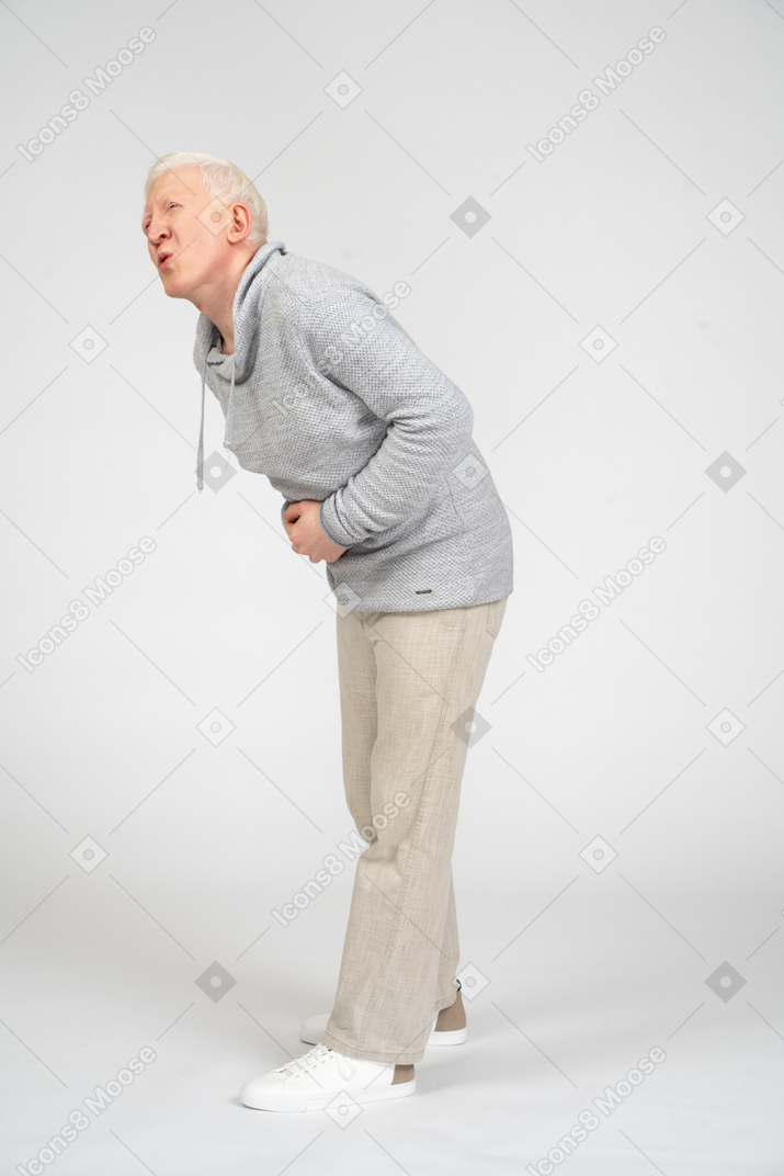 Middle-aged man experiencing extreme stomachache