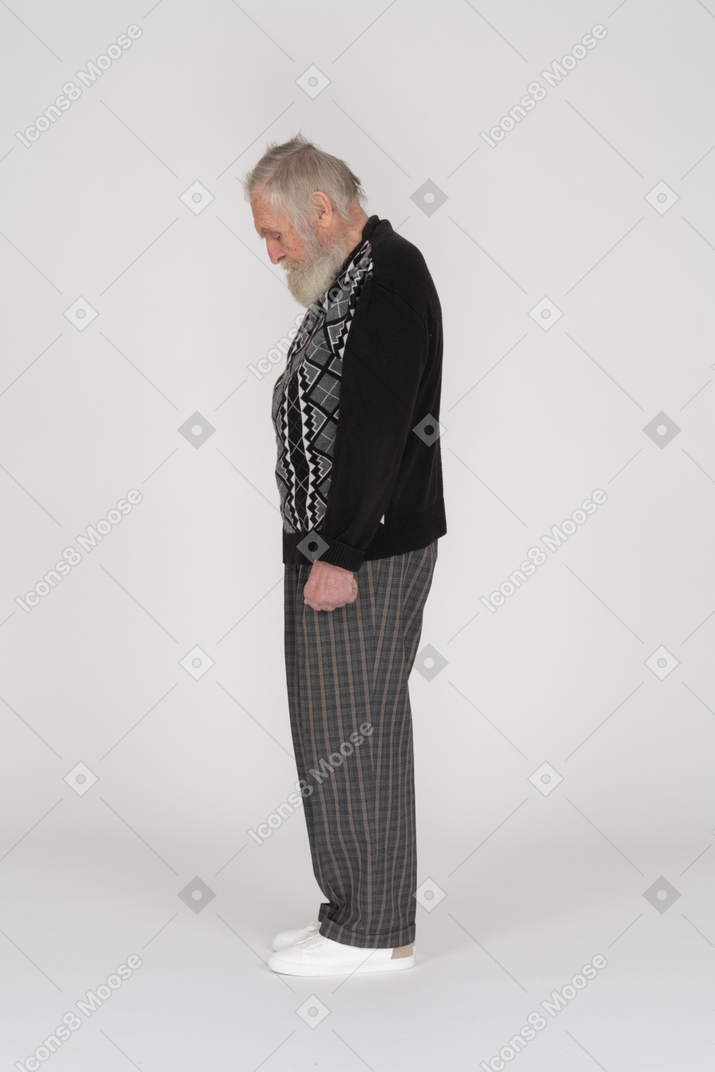 Side view of old man tilting head down