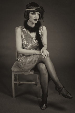 Beautiful flapper sitting on a chair