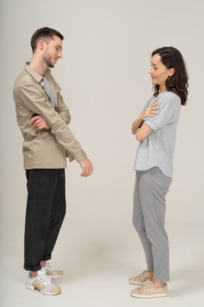 Side view of young couple speaking to each other