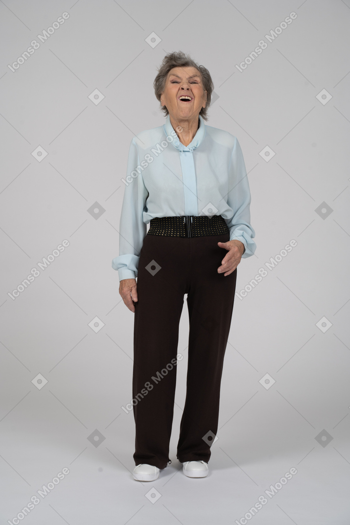 Front view of an old woman scoffing mockingly