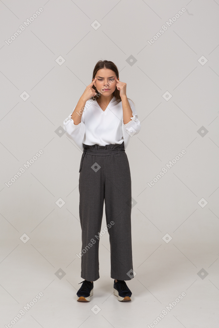 Front view of a young lady in office clothing with bad eyesight