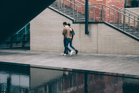 Two men walking in the city