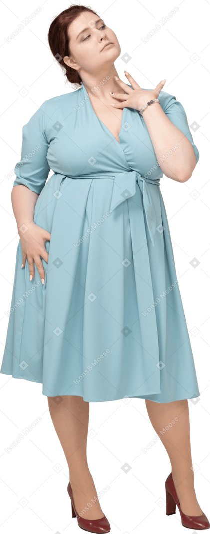 Front view of a woman in blue dress posing