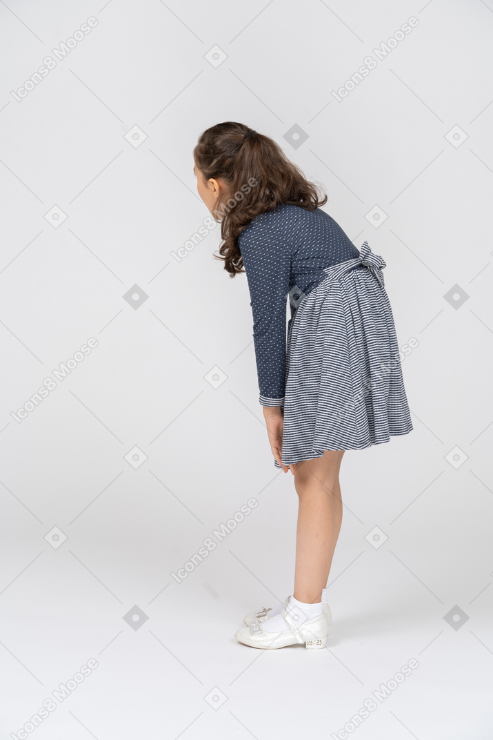 Side view of a girl slouching