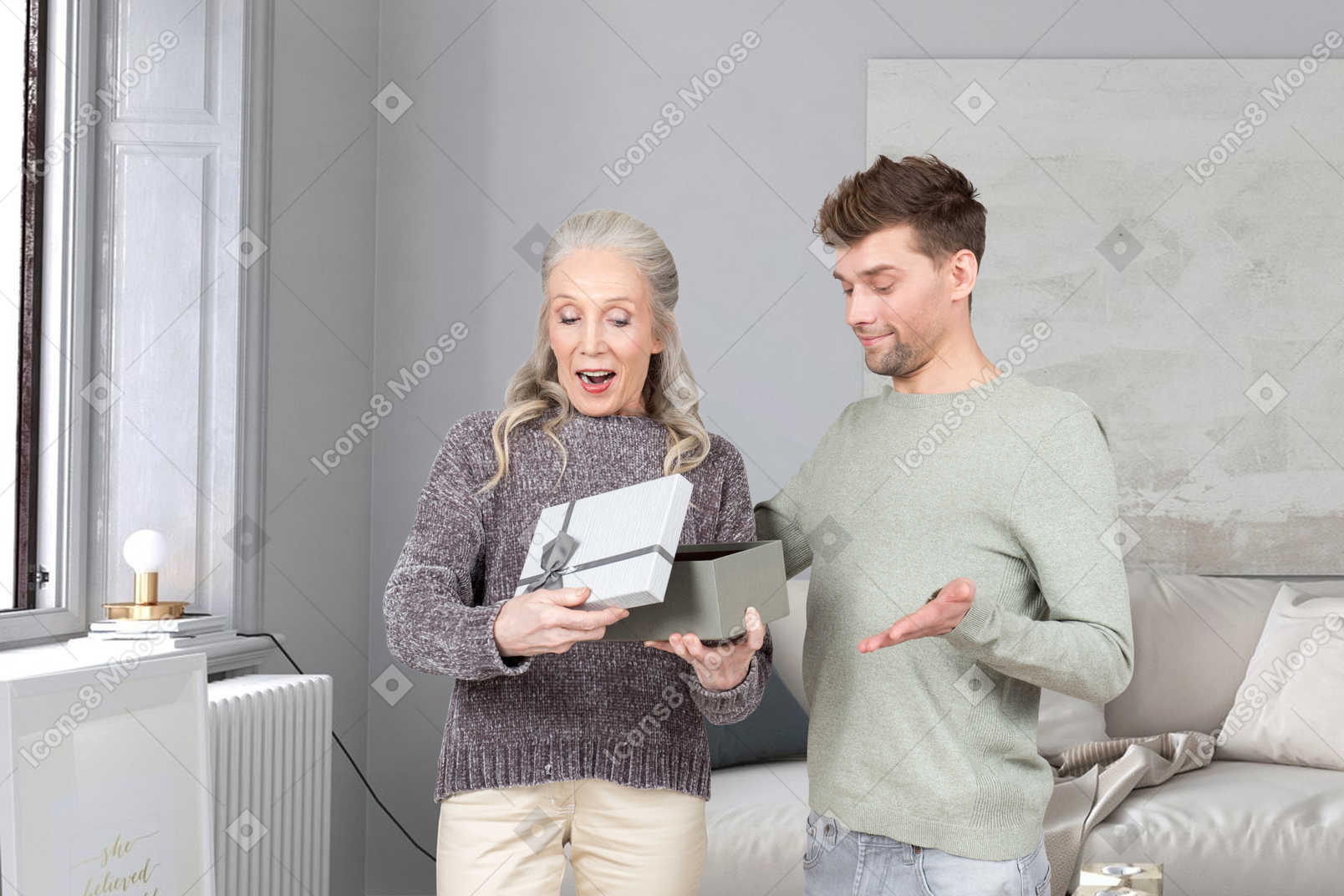 A man and a woman standing in a living room