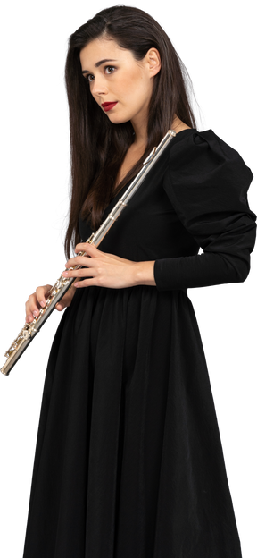 Front view of a young lady in black dress holding flute