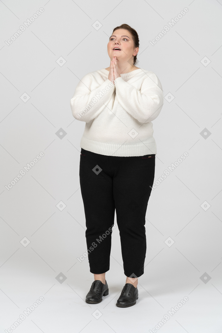 Plump woman in casual clothes dreaming