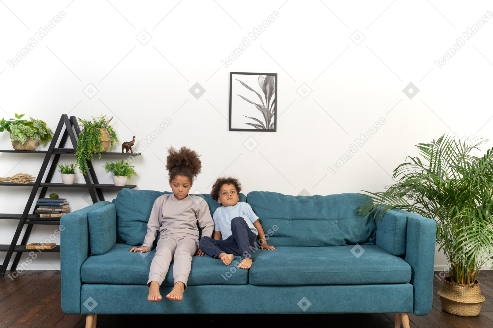 Cute boy and girl sitting on the sofa
