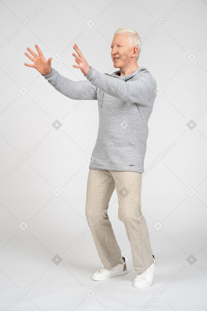 Man reaching his arms out and trying to catch something