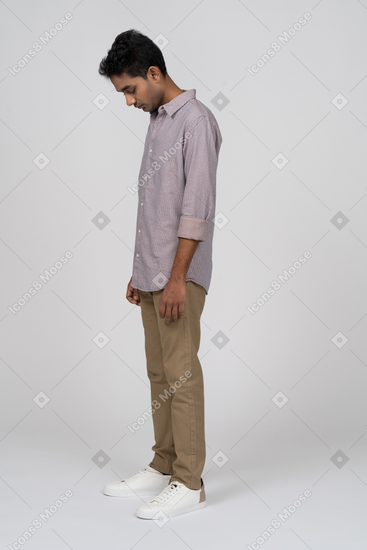 Young man in casual clothes standing