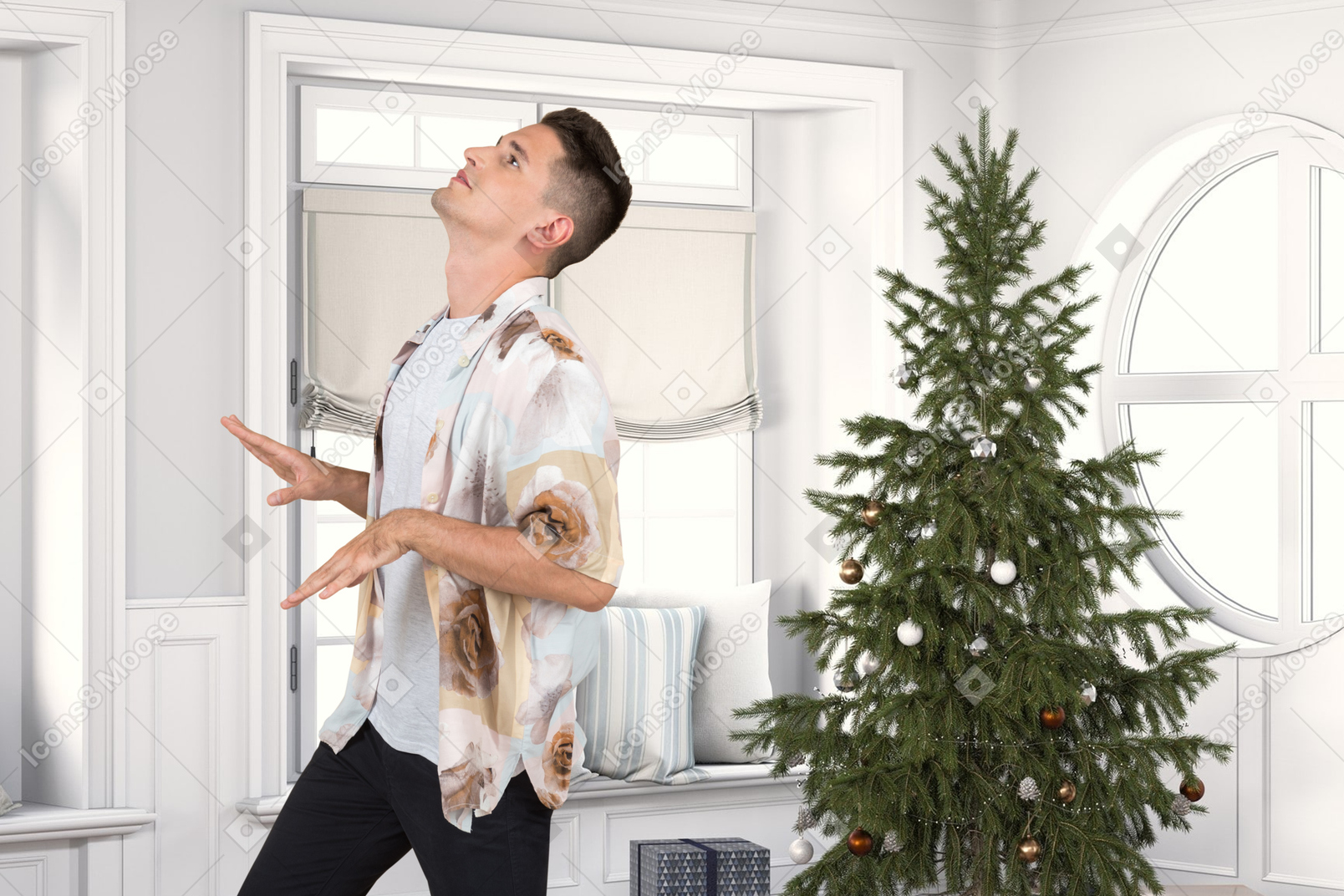 Junger mann, der nahe einem weihnachtsbaum tanzt