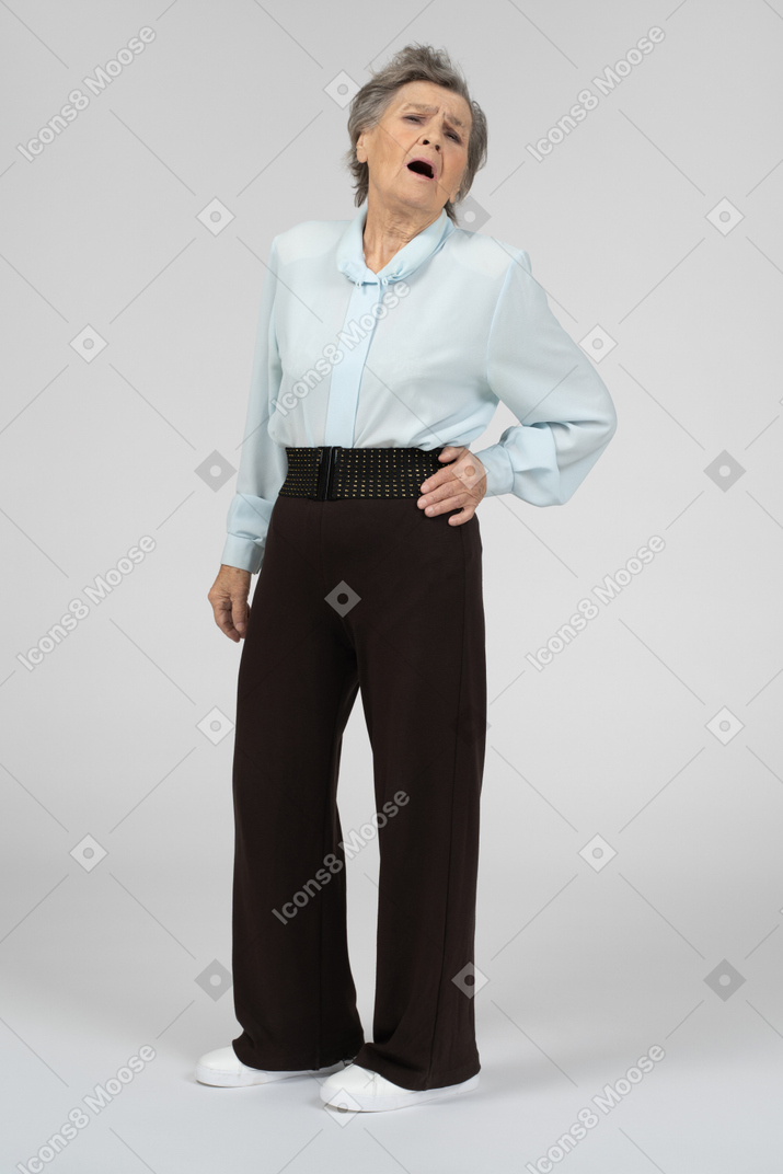 Front view of an old woman sighing dramatically