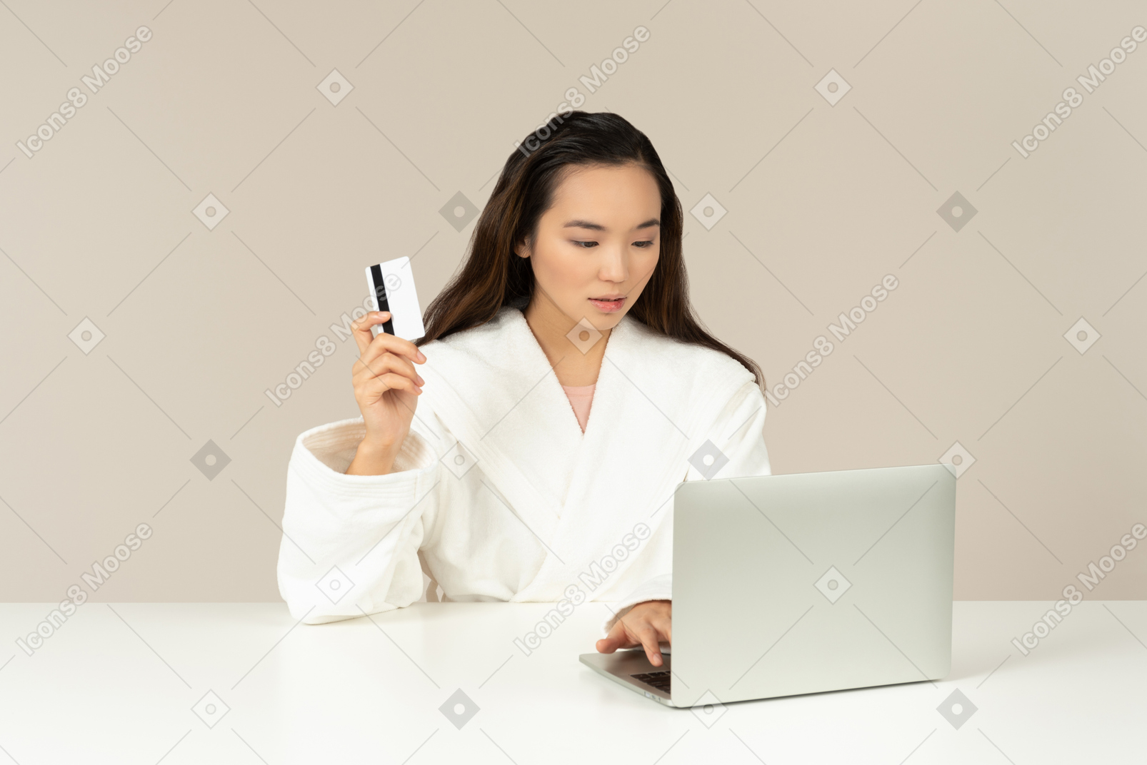 Bothered young asian woman doing online shopping