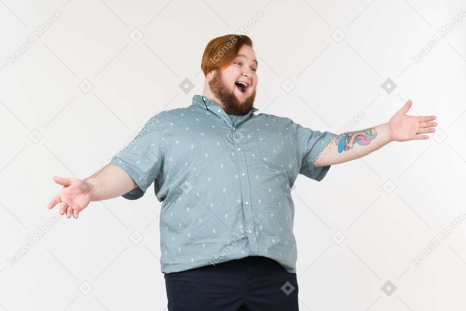A plump man standing with his hands on his hips and laughing