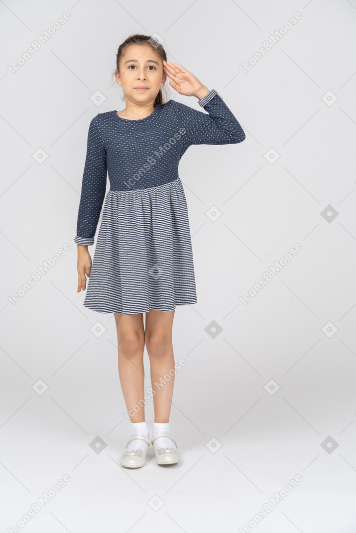 Front view of a girl saluting with a smile
