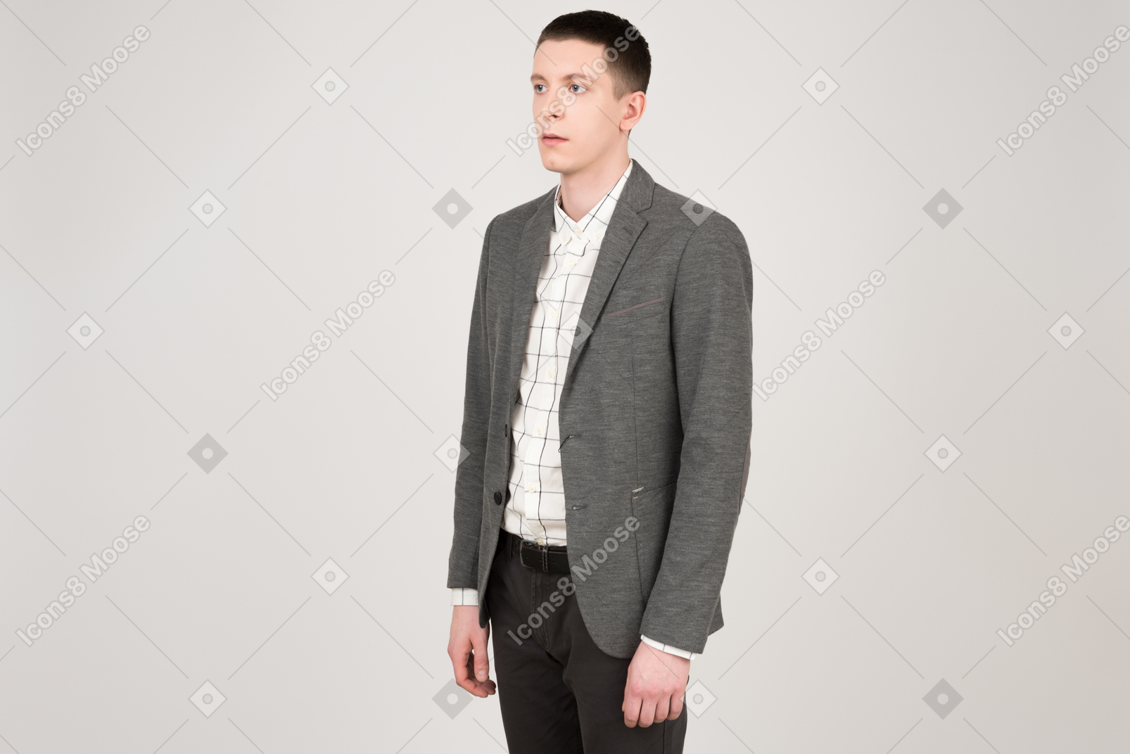 Young handsome man standing half sideways