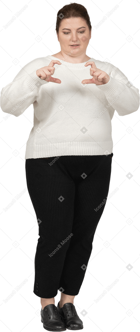 Plus size woman in casual clothes making heart sign