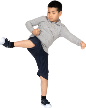 Front view of a boy with his leg up