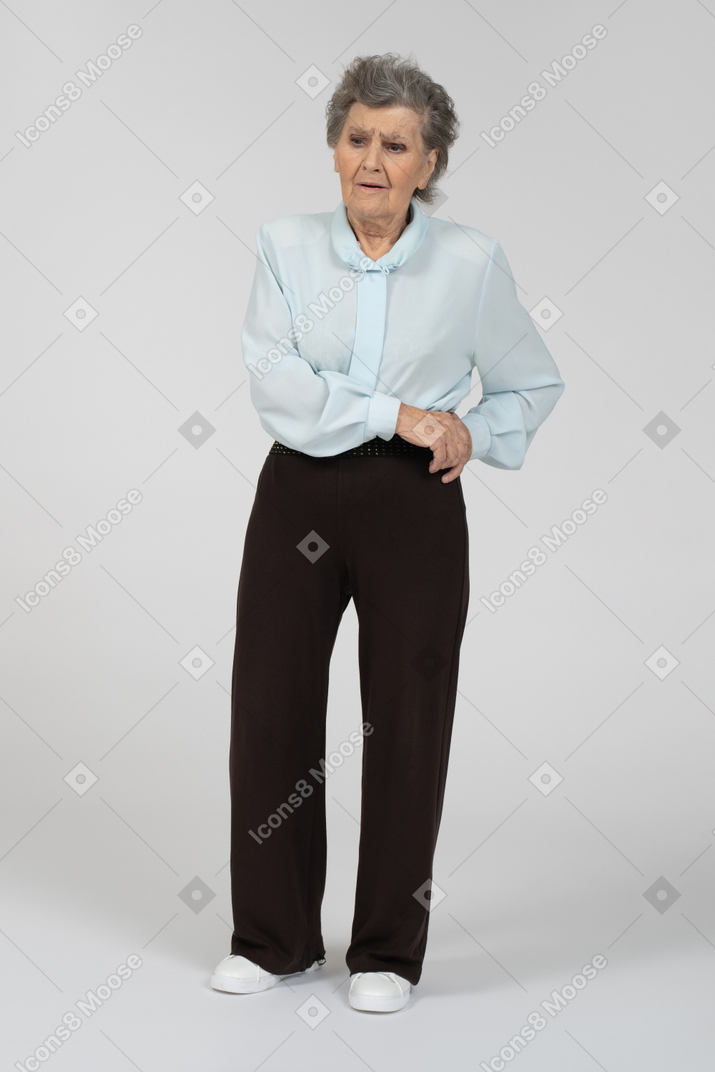 Front view of an old woman frowning sadly