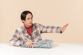 An asian geek guy in a checkered shirt