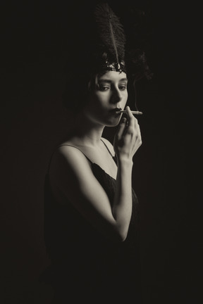 Black and white portrait of a flapper smoking cigarette