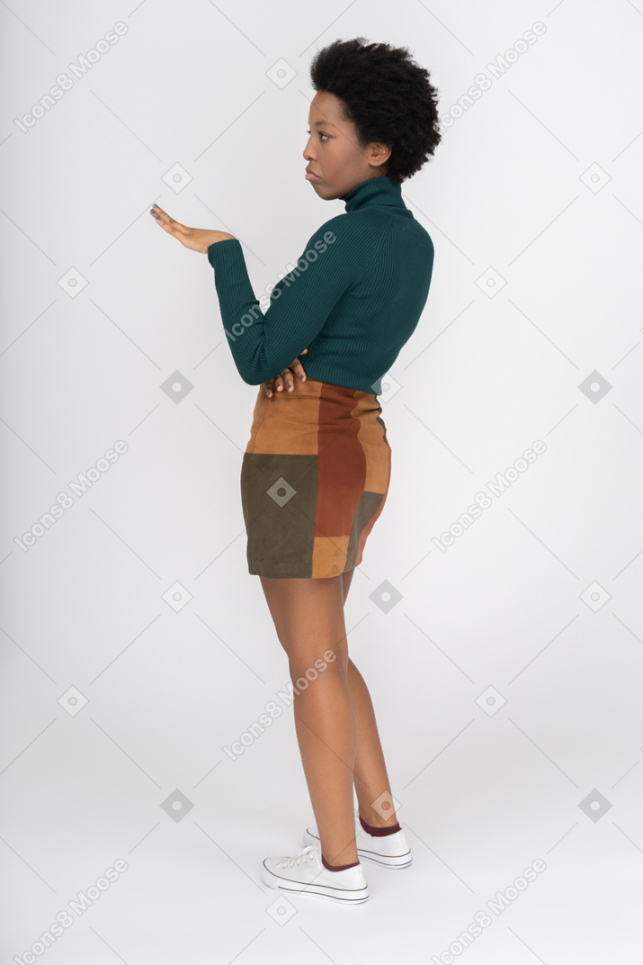 Self-confident african girl gesturing with one hand