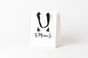 Cute little paper gift bag with black hands