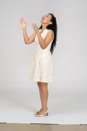 Woman in a white dress standing