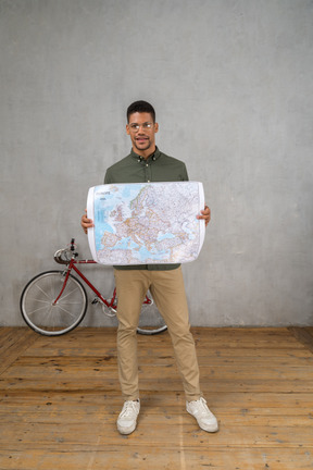 Front view of a man holding a map