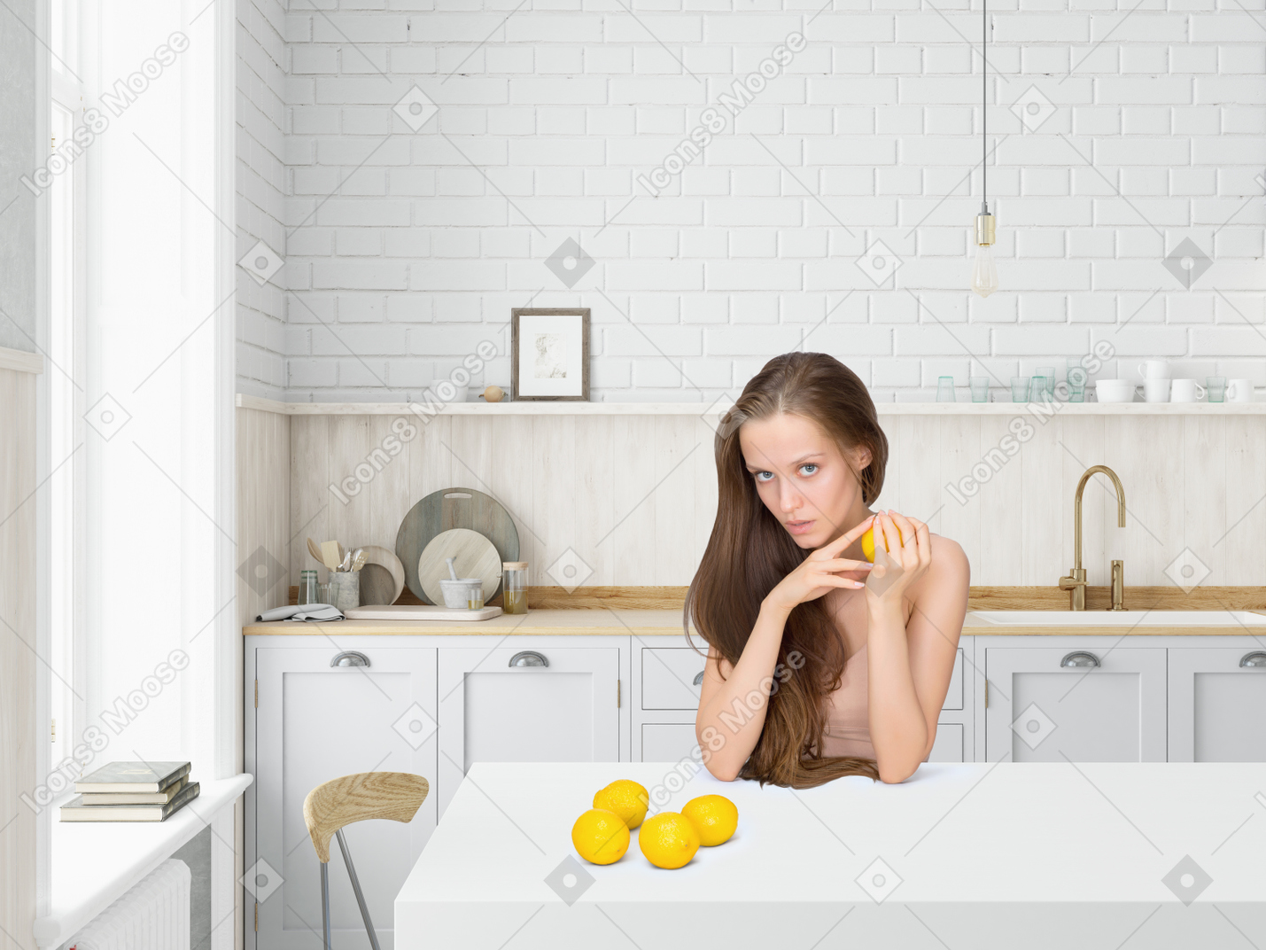 Young woman sitting in the kitchen and holding lemon