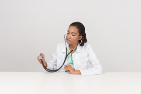 Beautiful female doctor with the stethoscope