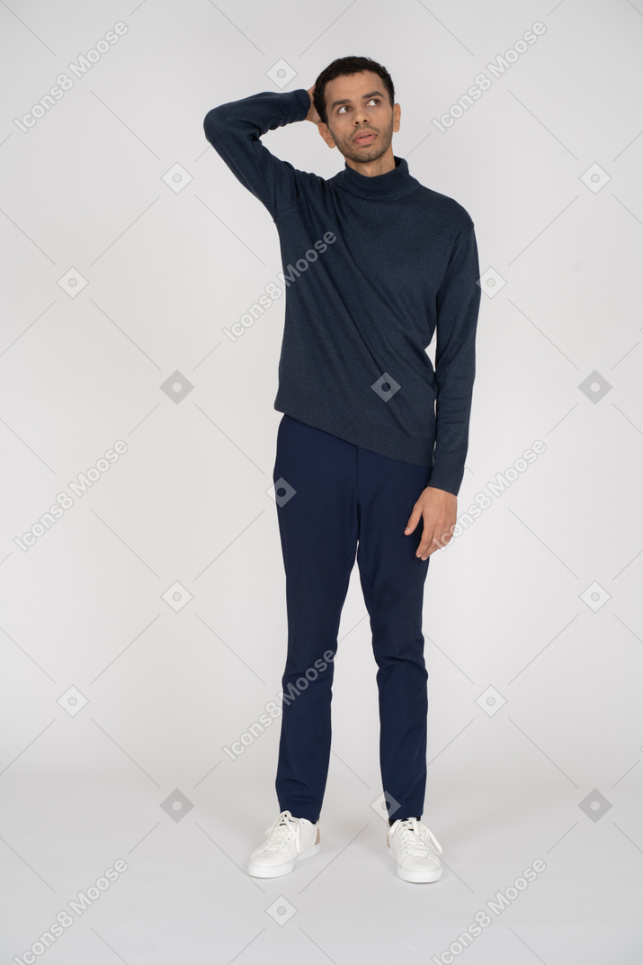 Man in casual clothes scratching his head