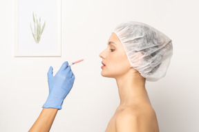 Young woman about to get botox injection