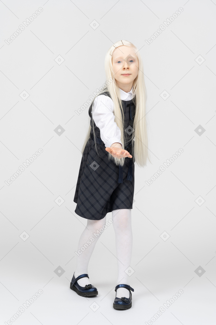 Schoolgirl holding out her hand