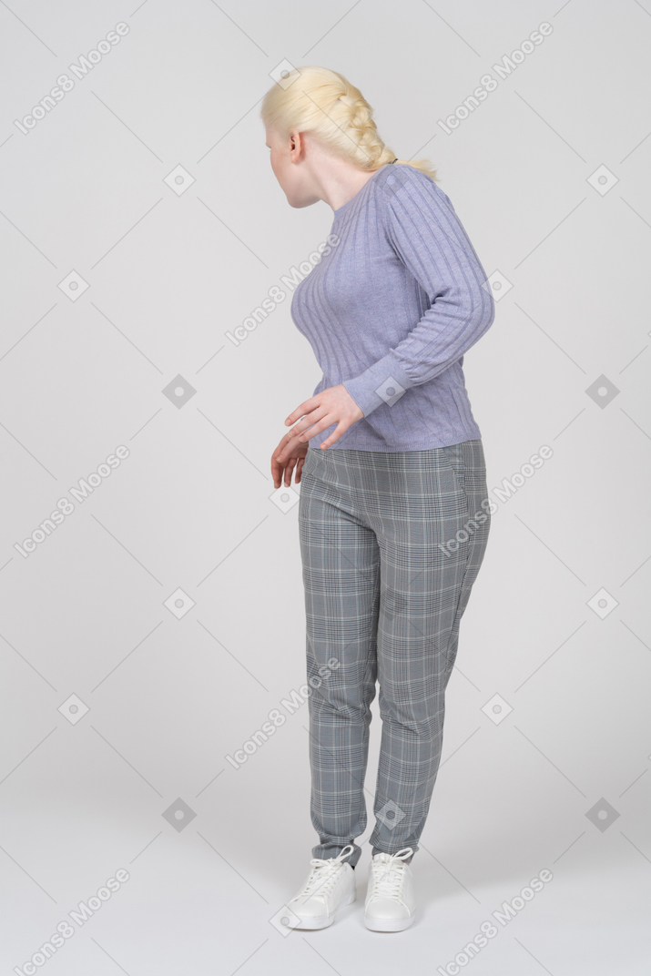 Young woman turning to look behind her