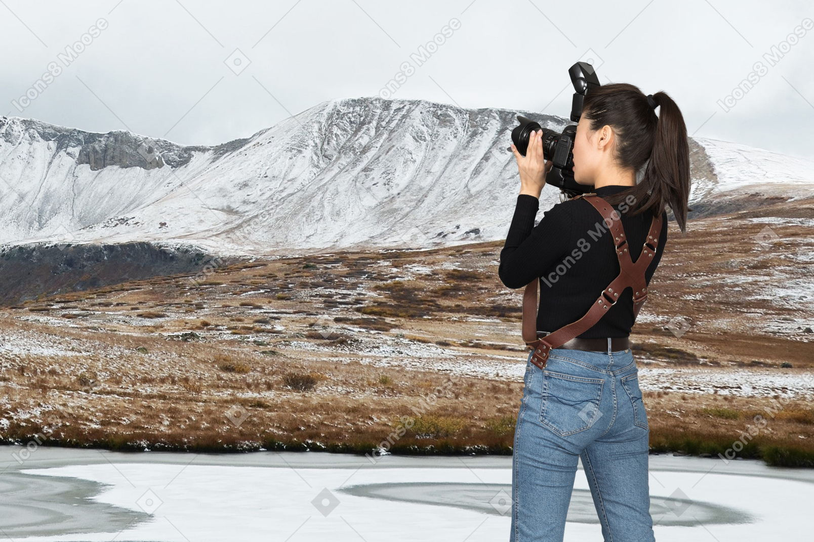 A photographer taking a picture of a landscape
